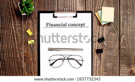 FINANCIAL CONCEPT text form on wooden table with office tips