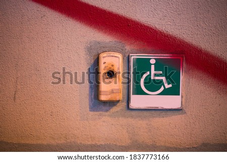 Button for calling staff to help people with disabilities and wheelchairs