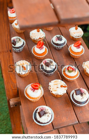 A picture of some cupcakes on a table arranged nicely