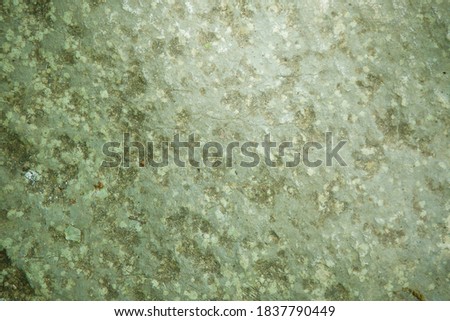 Texture of the surface of a wild stone, rock, or block. Natural material for use in design.