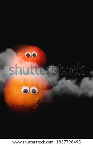 Kids Halloween pumpkins on an empty dark background, funny Halloween, cartoon-like, cute orange pumpkins, googley eyes