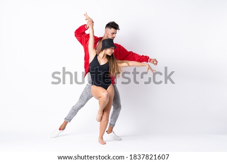 Couple dancing over isolated white background