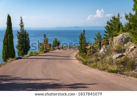 Serpentine road to Megali Petra beach in Lefkada Royalty-Free Stock Photo #1837845079