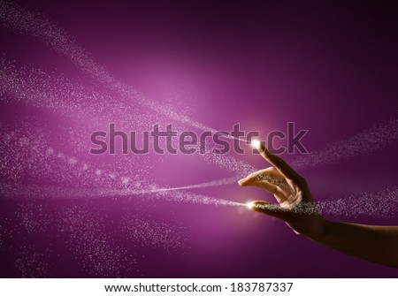 magic hand, conceptual image with glow on a colored background