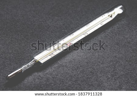 Old mercury thermometer to measure body temperature during illness