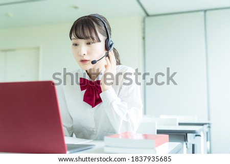 Asian female high school student taking online class. Royalty-Free Stock Photo #1837935685