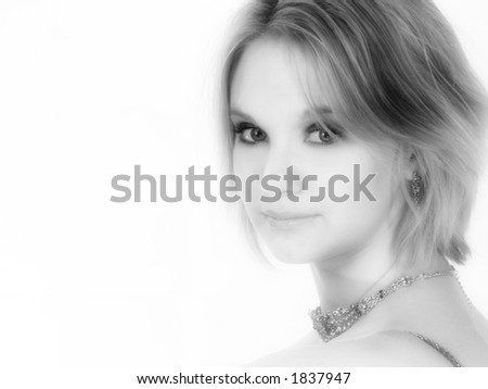 Beautiful 17 year old young woman in black and white.  Headshot over white.