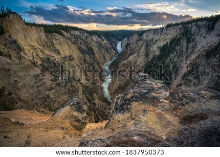 lower falls of the yellowstone national park from artist point at sunset, wyoming in the usa