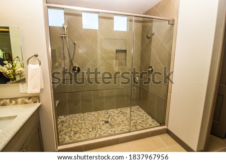 Oversize Clear Glass Walk-In Shower With Two Shower Heads Royalty-Free Stock Photo #1837967956