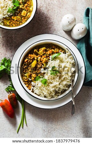 indian lentil dhal with vegetables and basmati rice on the table. healthy vegan Ayurvedic cuisine Royalty-Free Stock Photo #1837979476