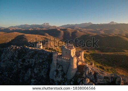 Castle of Rocca Calascio with mountains at sunrise. Royalty-Free Stock Photo #1838006566