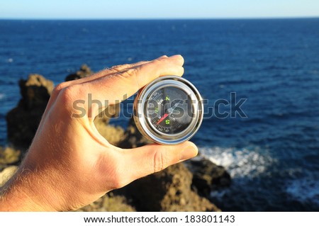 Orientation Concept a Male Hand Holding Metal Compass