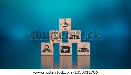 Concept of 5G with icons on wooden cubes