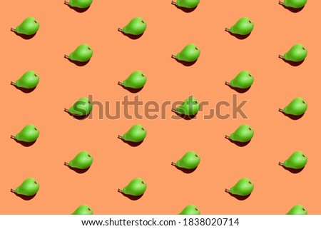 Juicy pears seamless pattern. Colorful seamless pattern of fresh pears on an orange background. Fresh ripe organic pears isolated on orange surface. Vegan, vegetarian healthy food. Diet product.