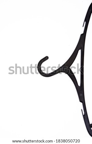 Black plastic hanger, isolated on a white background