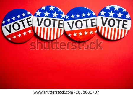 Vote buttons on red background with copy space. Election theme