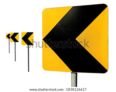 Sharp turn road signs. Black arrows on yellow traffic sign pointing left.