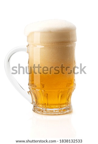 Mug with foamy beer isolated on white background. Clipping path included.
