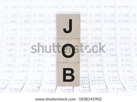 wooden cubes with JOB text on the background of numbers. Opportunity, Recruitment and business concepts
