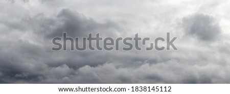 Panorama of stormy sky with gray clouds