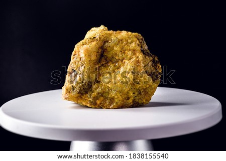 uranium ore, on electronic scale. Metal used in industry. Mineral extraction concept. Royalty-Free Stock Photo #1838155540