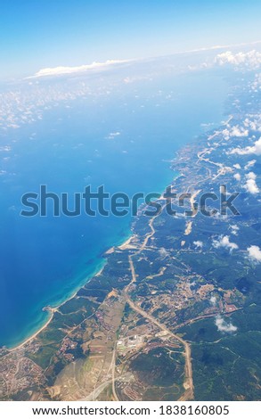 The view from the airplane window to the ground. Landscape view from the sky.