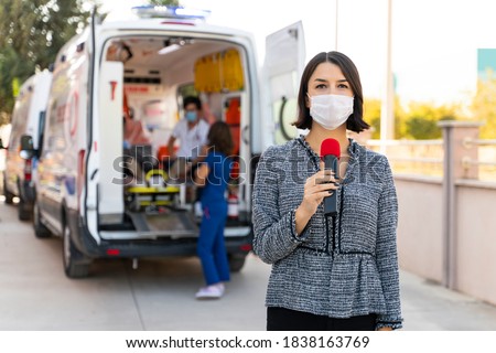 TV news reporter is making reportage about a virus epidemic in the hospital Royalty-Free Stock Photo #1838163769