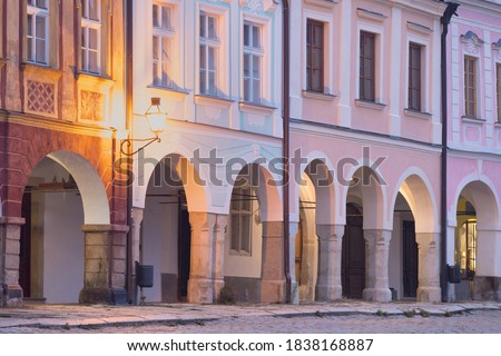 Traditional houses on the main square of Telc, South Moravia, Czech Republic. UNESCO heritage site. Town square in Telc with renaissance and baroque colorful houses. Early evening or night scene. Royalty-Free Stock Photo #1838168887