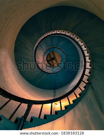 Spiral staircase of an old lighthouse. conceptual image of ascension, profitability, leading, success. Fine art.