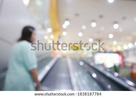 blurred inside shopping mall for background.