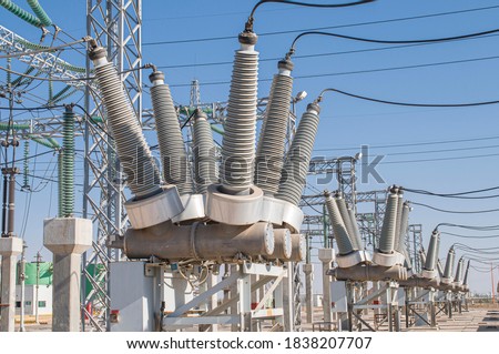 sulfur hexafluoride circuit breakers group of electric power line Sf6 circuit breakers in geothermal power substation with current transformers and insulators Royalty-Free Stock Photo #1838207707