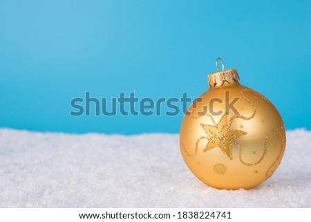 Merry Christmas eve noel concept. Close up photo picture of single beautiful tree decor ball with shiny ornament lie on soft snow