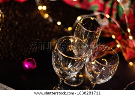 table for the christmas and new year parties with plate glass covered on wood and christmas decorations lights boketh 2020 new year 2021 southern hemisphere summer