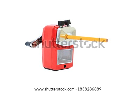 Rotary pencil sharpener with yellow pencil isolated on white background.