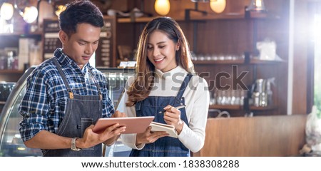 Banner Asian Young Small business owner discussing and coaching job together with colleague in domestic coffee shop, entrepreneur and startup, using technology laptop and lecture, business partner

