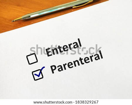 One person is answering question. He is choosing between enteral and parenteral medication route. Royalty-Free Stock Photo #1838329267
