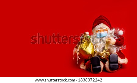 Santa Claus Wearing Medical Mask During Coronavirus Christmas Party New Year Card Or Banner With Copy Space.