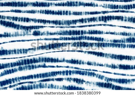 Indigo Blue Shibori Tie dye fabric texture pattern. White and Blue colors Royalty-Free Stock Photo #1838380399