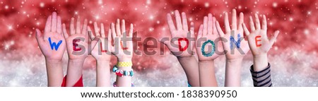 Children Hands Building Word Well Done, Red Christmas Background
