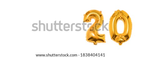 Golden number 20 twenty made of inflatable balloon isolated on white background.Banner. Copy space for text