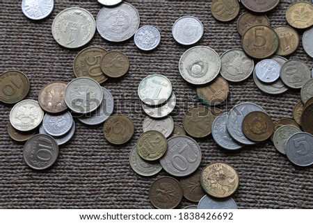 coins of different countries of the world on the table