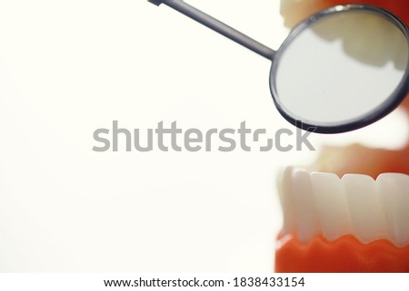 Dentist's office. Dentist examines the oral cavity treatment. The doctor shows a course of treatment. Caries treatment. Implantation and installation of veneers.