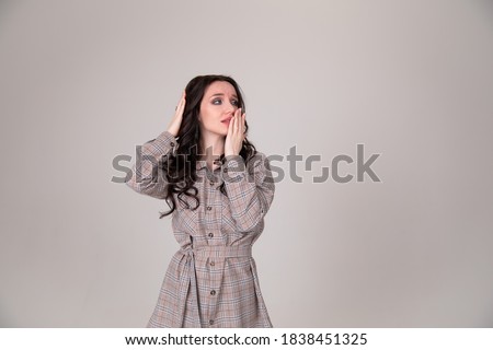 Beautiful girl student business woman thought on gray or white background