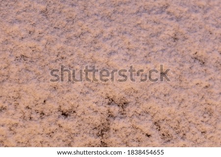 Snow at sunset as an abstract background. Texture.