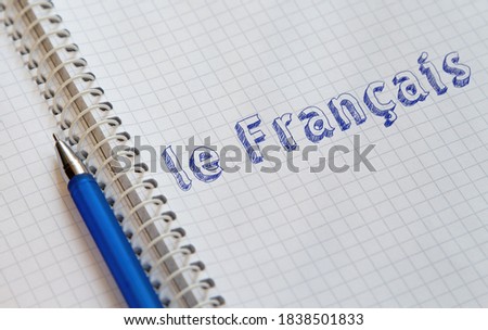 Hand drawing French on sheet of notebook