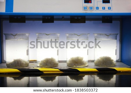 Industrial Jar test , pilot-scale test of the treatment chemicals used in a particular water plant Royalty-Free Stock Photo #1838503372