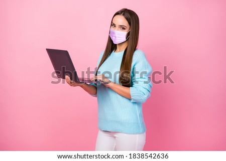 Profile photo of pretty business lady hold notebook wear mask blue sweater white pants isolated pastel pink color background