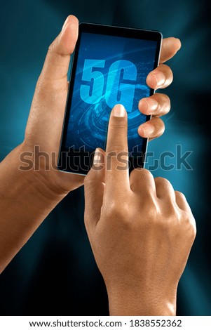 a woman finger connect to 5G network on a smart phone.