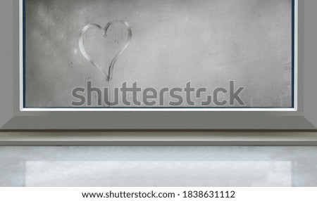 Heart sign on smoky glass