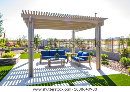 Rear Patio Pergola With Wooden Furniture Royalty-Free Stock Photo #1838640988